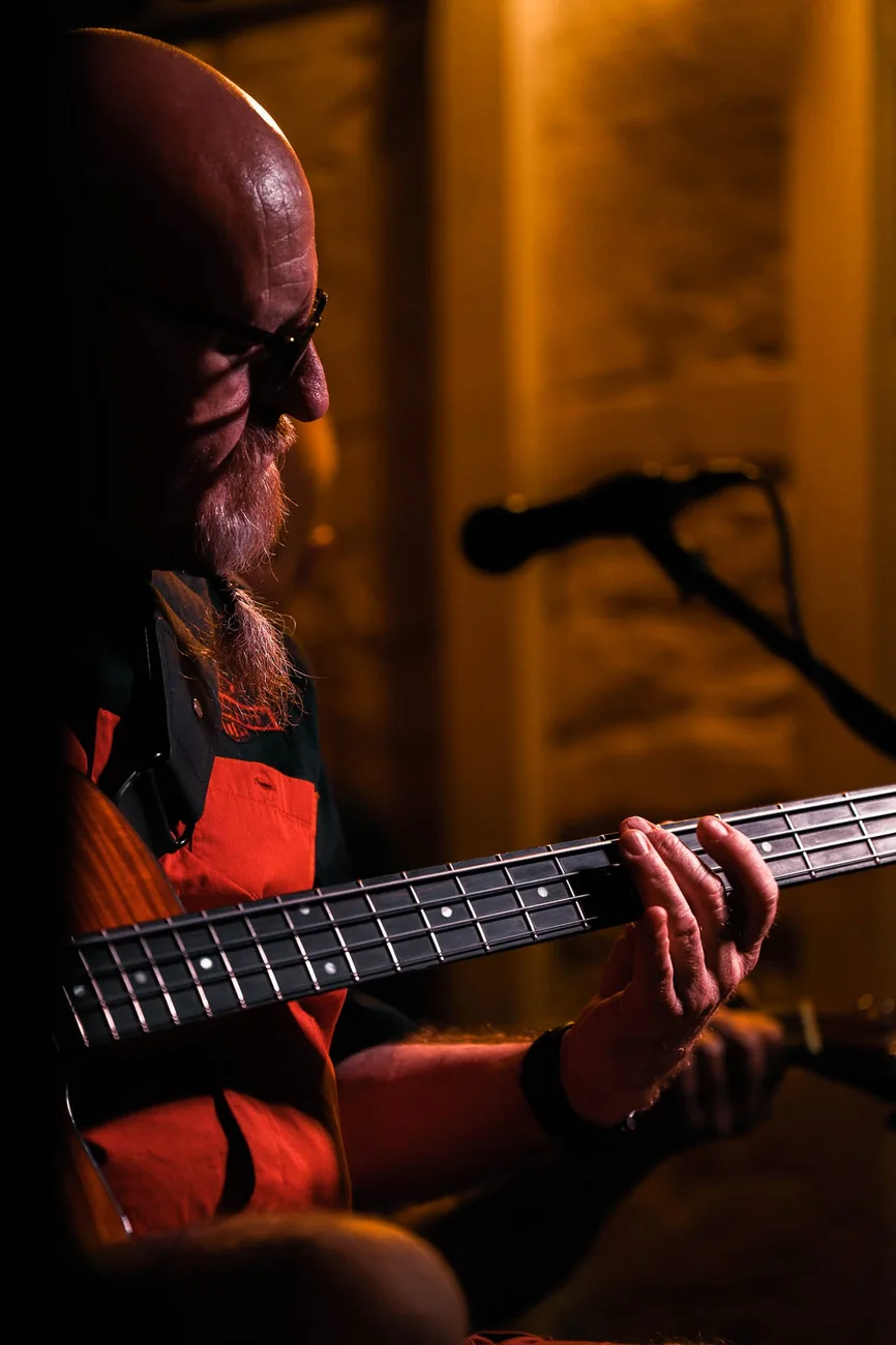 Dave Oliver playing bass guitar
