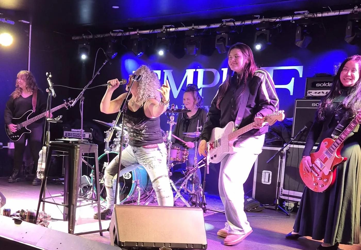 The Wags having a go on stage with Electric Outlawz