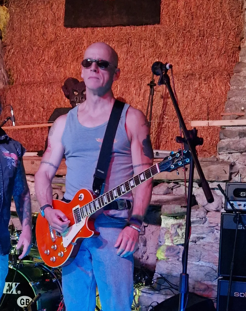 Jon Montgomery playing guitar with Electric Outlawz