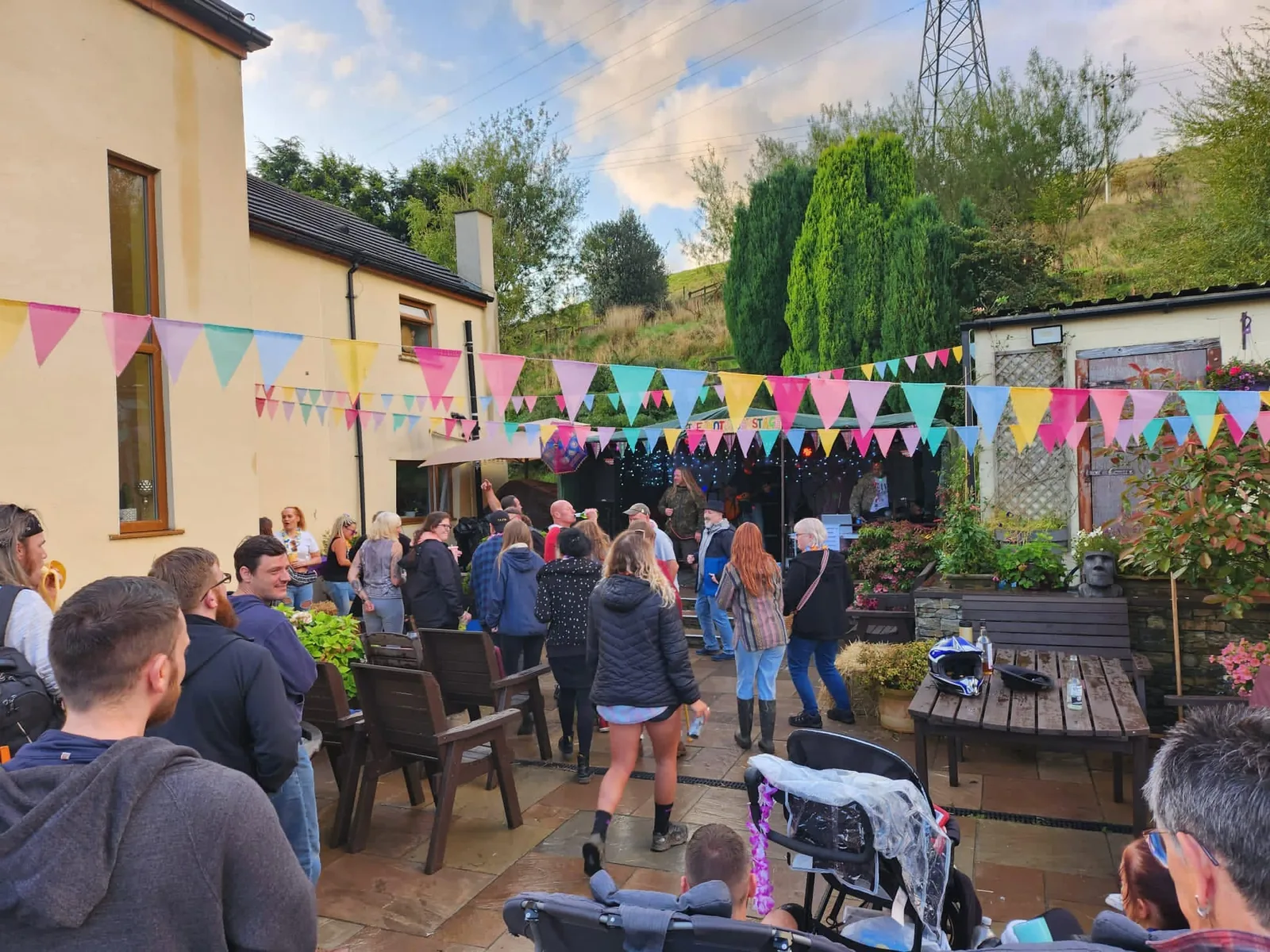 Crowd watching Electric Outlawz at a private outdoor event