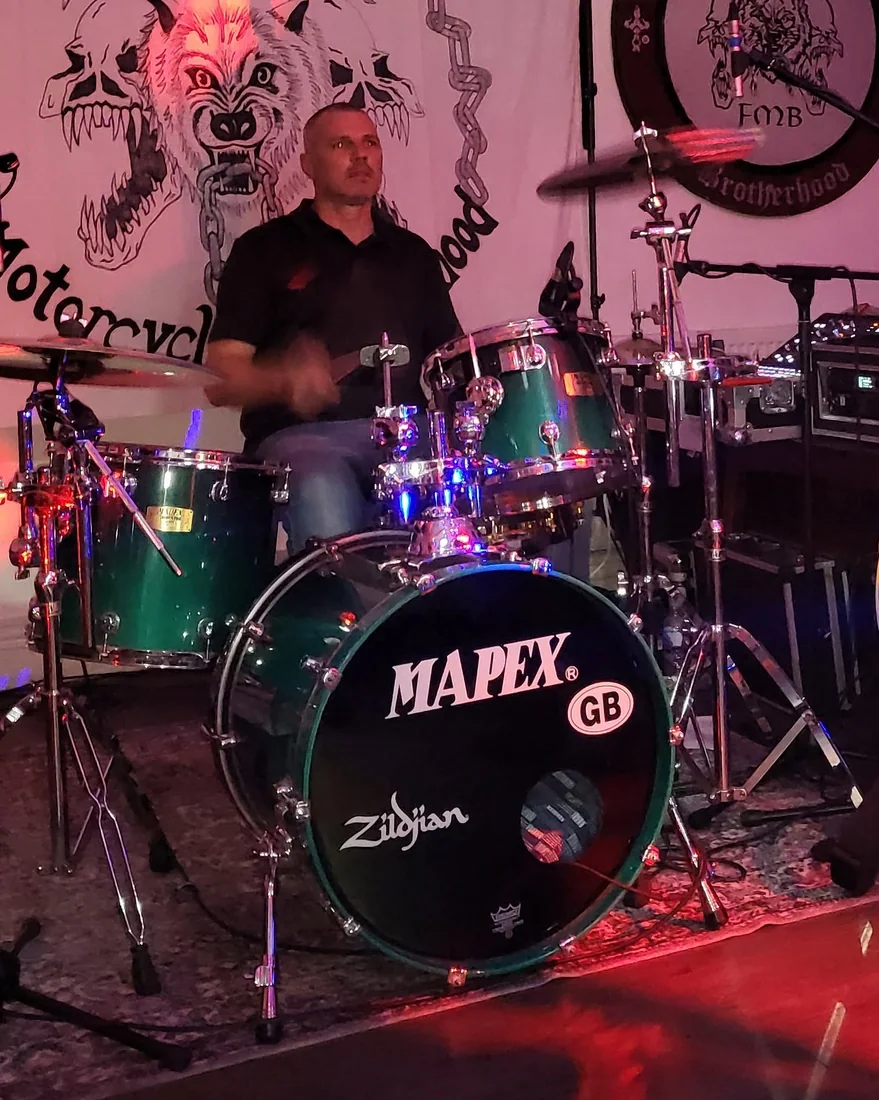 Toby Ferguson playing drums with Electric Outlawz