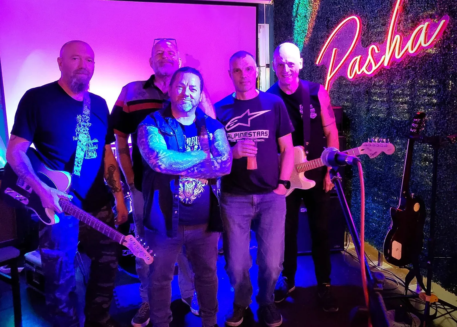 Electric Outlawz band members at a venue
